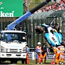 SUZUKA, JAPAN - OCTOBER 13: The car of Robert Kubica of Poland and Williams is removed from the circuit after he crashed during qualifying for the F1 Grand Prix of Japan at Suzuka Circuit on October 13, 2019 in Suzuka, Japan. (Photo by Charles Coates/Getty Images)