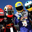 SUZUKA, JAPAN - OCTOBER 13: Ferrari, Red Bull Racing, Williams and McLaren fans show their support