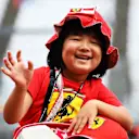 SUZUKA, JAPAN - OCTOBER 10: Young Ferrari fans get excited in the Pitlane during previews ahead of the F1 Grand Prix of Japan at Suzuka Circuit on October 10, 2019 in Suzuka, Japan. (Photo by Clive Mason/Getty Images)