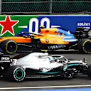 MEXICO CITY, MEXICO - OCTOBER 25: Valtteri Bottas driving the (77) Mercedes AMG Petronas F1 Team Mercedes W10 faces the wrong way as he is passed by Lando Norris of Great Britain driving the (4) McLaren F1 Team MCL34 Renault on track during practice for the F1 Grand Prix of Mexico at Autodromo Hermanos Rodriguez on October 25, 2019 in Mexico City, Mexico. (Photo by Mark Thompson/Getty Images)