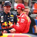 MEXICO CITY, MEXICO - OCTOBER 26: Pole position qualifier Max Verstappen of Netherlands and Red Bull Racing talks with third place qualifier Sebastian Vettel of Germany and Ferrari in parc ferme during qualifying for the F1 Grand Prix of Mexico at Autodromo Hermanos Rodriguez on October 26, 2019 in Mexico City, Mexico. (Photo by Dan Istitene/Getty Images)