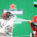 MEXICO CITY, MEXICO - OCTOBER 27: Race winner Lewis Hamilton of Great Britain and Mercedes GP and second placed Sebastian Vettel of Germany and Ferrari celebrate on the podium during the F1 Grand Prix of Mexico at Autodromo Hermanos Rodriguez on October 27, 2019 in Mexico City, Mexico. (Photo by Mark Thompson/Getty Images)