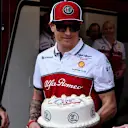 MONTE CARLO, MONACO - MAY 26: Kimi Raikkonen, Alfa Romeo Racing, is presented with a cake to commemorate his 300th race during the Monaco GP at Monte Carlo on May 26, 2019 in Monte Carlo, Monaco. (Photo by Jerry Andre / Sutton Images)