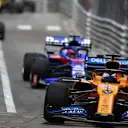MONTE CARLO, MONACO - MAY 26: Carlos Sainz, McLaren MCL34, leads Daniil Kvyat, Toro Rosso STR14 during the Monaco GP at Monte Carlo on May 26, 2019 in Monte Carlo, Monaco. (Photo by Dom Romney / LAT Images)