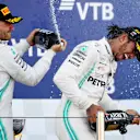 SOCHI, RUSSIA - SEPTEMBER 29: Race winner Lewis Hamilton of Great Britain and Mercedes GP and second placed Valtteri Bottas of Finland and Mercedes GP celebrate on the podium during the F1 Grand Prix of Russia at Sochi Autodrom on September 29, 2019 in Sochi, Russia. (Photo by Clive Mason/Getty Images)