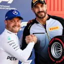 CIRCUIT DE BARCELONA-CATALUNYA, SPAIN - MAY 11: WWE wrestler Cesaro presents Valtteri Bottas, Mercedes AMG F1, with his Pirelli Pole Position award during the Spanish GP at Circuit de Barcelona-Catalunya on May 11, 2019 in Circuit de Barcelona-Catalunya, Spain. (Photo by Mark Sutton / Sutton Images)