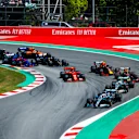 CIRCUIT DE BARCELONA-CATALUNYA, SPAIN - MAY 12: Lewis Hamilton, Mercedes AMG F1 W10, leads Valtteri Bottas, Mercedes AMG W10 into the first corner as Sebastian Vettel, Ferrari SF90 runs wide ahead of Max Verstappen, Red Bull Racing RB15, Charles Leclerc, Ferrari SF90, Pierre Gasly, Red Bull Racing RB15, and the rest of the field during the Spanish GP at Circuit de Barcelona-Catalunya on May 12, 2019 in Circuit de Barcelona-Catalunya, Spain. (Photo by Andy Hone / LAT Images)