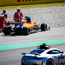 CIRCUIT DE BARCELONA-CATALUNYA, SPAIN - MAY 12: Safety Car drives past the car of Lando Norris, McLaren MCL34 being recovered by marshals during the Spanish GP at Circuit de Barcelona-Catalunya on May 12, 2019 in Circuit de Barcelona-Catalunya, Spain. (Photo by Andy Hone / LAT Images)