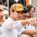 BAHRAIN INTERNATIONAL CIRCUIT, BAHRAIN - APRIL 02: Lando Norris, McLaren, talks about the track with the team during the Bahrain April testing at Bahrain International Circuit on April 02, 2019 in Bahrain International Circuit, Bahrain. (Photo by Mark Sutton / Sutton Images)