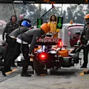 CIRCUIT DE BARCELONA-CATALUNYA, SPAIN - FEBRUARY 20: Carlos Sainz Jr, McLaren MCL34 pit stop during the Barcelona February testing at Circuit de Barcelona-Catalunya on February 20, 2019 in Circuit de Barcelona-Catalunya, Spain. (Photo by Mark Sutton / Sutton Images)