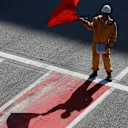 CIRCUIT DE BARCELONA-CATALUNYA, SPAIN - FEBRUARY 26: Marshal waves the red flag during the Barcelona February testing II at Circuit de Barcelona-Catalunya on February 26, 2019 in Circuit de Barcelona-Catalunya, Spain. (Photo by Zak Mauger / LAT Images)