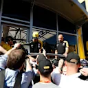 CIRCUIT DE BARCELONA-CATALUNYA, SPAIN - FEBRUARY 27: Daniel Ricciardo, Renault F1 Team signs autographs for the fans during the Barcelona February testing II at Circuit de Barcelona-Catalunya on February 27, 2019 in Circuit de Barcelona-Catalunya, Spain. (Photo by Glenn Dunbar / LAT Images)
