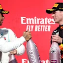 AUSTIN, TEXAS - NOVEMBER 03: 2019 Formula One World Drivers Champion Lewis Hamilton of Great Britain and Mercedes GP is congratulated by third placed Max Verstappen of Netherlands and Red Bull Racing on the podium during the F1 Grand Prix of USA at Circuit of The Americas on November 03, 2019 in Austin, Texas. (Photo by Charles Coates/Getty Images)
