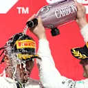 AUSTIN, TEXAS - NOVEMBER 03: Race winner Valtteri Bottas of Finland and Mercedes GP, 2019 Formula One World Drivers Champion Lewis Hamilton of Great Britain and Mercedes GP and James Allison, Technical Director at Mercedes GP celebrate on the podium during the F1 Grand Prix of USA at Circuit of The Americas on November 03, 2019 in Austin, Texas. (Photo by Charles Coates/Getty Images)