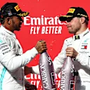 AUSTIN, TEXAS - NOVEMBER 03: 2019 Formula One World Drivers Champion Lewis Hamilton of Great Britain and Mercedes GP and race winner Valtteri Bottas of Finland and Mercedes GP celebrate on the podium during the F1 Grand Prix of USA at Circuit of The Americas on November 03, 2019 in Austin, Texas. (Photo by Mark Thompson/Getty Images)
