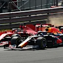 NORTHAMPTON, ENGLAND - AUGUST 09: Alexander Albon of Thailand driving the (23) Aston Martin Red Bull Racing RB16 and Sebastian Vettel of Germany driving the (5) Scuderia Ferrari SF1000 battle for position at  the start during the F1 70th Anniversary Grand Prix at Silverstone on August 09, 2020 in Northampton, England. (Photo by Clive Mason - Formula 1/Formula 1 via Getty Images)