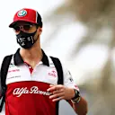 ABU DHABI, UNITED ARAB EMIRATES - DECEMBER 12: Antonio Giovinazzi of Italy and Alfa Romeo Racing walks in the Paddock before final practice ahead of the F1 Grand Prix of Abu Dhabi at Yas Marina Circuit on December 12, 2020 in Abu Dhabi, United Arab Emirates. (Photo by Mark Thompson/Getty Images)