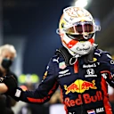 ABU DHABI, UNITED ARAB EMIRATES - DECEMBER 12: Pole position qualifier Max Verstappen of Netherlands and Red Bull Racing celebrates with his team in parc ferme during qualifying ahead of the F1 Grand Prix of Abu Dhabi at Yas Marina Circuit on December 12, 2020 in Abu Dhabi, United Arab Emirates. (Photo by Mark Thompson/Getty Images)