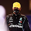 ABU DHABI, UNITED ARAB EMIRATES - DECEMBER 12: Third place qualifier Lewis Hamilton of Great Britain and Mercedes GP looks on in parc ferme during qualifying ahead of the F1 Grand Prix of Abu Dhabi at Yas Marina Circuit on December 12, 2020 in Abu Dhabi, United Arab Emirates. (Photo by Mario Renzi - Formula 1/Formula 1 via Getty Images)