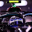 ABU DHABI, UNITED ARAB EMIRATES - DECEMBER 12: Second place qualifier Valtteri Bottas of Finland and Mercedes GP stops in parc ferme during qualifying ahead of the F1 Grand Prix of Abu Dhabi at Yas Marina Circuit on December 12, 2020 in Abu Dhabi, United Arab Emirates. (Photo by Mario Renzi - Formula 1/Formula 1 via Getty Images)