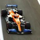 ABU DHABI, UNITED ARAB EMIRATES - DECEMBER 13: Lando Norris of Great Britain driving the (4) McLaren F1 Team MCL35 Renault on his way to the grid prior to the F1 Grand Prix of Abu Dhabi at Yas Marina Circuit on December 13, 2020 in Abu Dhabi, United Arab Emirates. (Photo by Bryn Lennon/Getty Images)