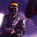 ABU DHABI, UNITED ARAB EMIRATES - DECEMBER 13: Third placed Lewis Hamilton of Great Britain and Mercedes GP celebrates on the podium during the F1 Grand Prix of Abu Dhabi at Yas Marina Circuit on December 13, 2020 in Abu Dhabi, United Arab Emirates. (Photo by Mario Renzi - Formula 1/Formula 1 via Getty Images)