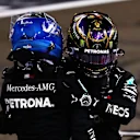 ABU DHABI, UNITED ARAB EMIRATES - DECEMBER 13: Second placed Valtteri Bottas of Finland and Mercedes GP and third placed Lewis Hamilton of Great Britain and Mercedes GP hug in parc ferme during the F1 Grand Prix of Abu Dhabi at Yas Marina Circuit on December 13, 2020 in Abu Dhabi, United Arab Emirates. (Photo by Dan Istitene - Formula 1/Formula 1 via Getty Images)