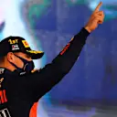 ABU DHABI, UNITED ARAB EMIRATES - DECEMBER 13: Race winner Max Verstappen of Netherlands and Red Bull Racing celebrates on the podium during the F1 Grand Prix of Abu Dhabi at Yas Marina Circuit on December 13, 2020 in Abu Dhabi, United Arab Emirates. (Photo by Clive Mason - Formula 1/Formula 1 via Getty Images)
