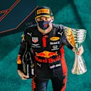 ABU DHABI, UNITED ARAB EMIRATES - DECEMBER 13: Race winner Max Verstappen of Netherlands and Red Bull Racing celebrates on the podium during the F1 Grand Prix of Abu Dhabi at Yas Marina Circuit on December 13, 2020 in Abu Dhabi, United Arab Emirates. (Photo by Peter Fox/Getty Images)
