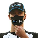 ABU DHABI, UNITED ARAB EMIRATES - DECEMBER 13: George Russell of Great Britain and Williams looks on from the grid prior to during the F1 Grand Prix of Abu Dhabi at Yas Marina Circuit on December 13, 2020 in Abu Dhabi, United Arab Emirates. (Photo by Dan Istitene - Formula 1/Formula 1 via Getty Images)