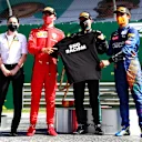SPIELBERG, AUSTRIA - JULY 05: Race winner Valtteri Bottas of Finland and Mercedes GP, second placed Charles Leclerc of Monaco and Ferrari and third placed Lando Norris of Great Britain and McLaren F1 pose with an End Racism shirt during the Formula One Grand Prix of Austria at Red Bull Ring on July 05, 2020 in Spielberg, Austria. (Photo by Dan Istitene - Formula 1/Formula 1 via Getty Images)