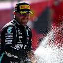 SPIELBERG, AUSTRIA - JULY 05: Race winner Valtteri Bottas of Finland and Mercedes GP celebrates on the podium during the Formula One Grand Prix of Austria at Red Bull Ring on July 05, 2020 in Spielberg, Austria. (Photo by Mario Renzi - Formula 1/Formula 1 via Getty Images)