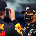 BAHRAIN, BAHRAIN - NOVEMBER 28: Pole position qualifier Lewis Hamilton of Great Britain and Mercedes GP speaks with third placed qualifier Max Verstappen of Netherlands and Red Bull Racing in parc ferme during qualifying ahead of the F1 Grand Prix of Bahrain at Bahrain International Circuit on November 28, 2020 in Bahrain, Bahrain. (Photo by Hamad Mohammed - Pool/Getty Images)