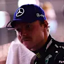 BAHRAIN, BAHRAIN - NOVEMBER 28: Second place qualifier Valtteri Bottas of Finland and Mercedes GP wipes his face in parc ferme during qualifying ahead of the F1 Grand Prix of Bahrain at Bahrain International Circuit on November 28, 2020 in Bahrain, Bahrain. (Photo by Mario Renzi - Formula 1/Formula 1 via Getty Images)