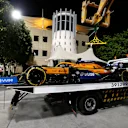 BAHRAIN, BAHRAIN - NOVEMBER 28: The car of Carlos Sainz of Spain and McLaren F1 is seen on a pickup truck after retiring during qualifying ahead of the F1 Grand Prix of Bahrain at Bahrain International Circuit on November 28, 2020 in Bahrain, Bahrain. (Photo by Hamad Mohammed - Pool/Getty Images)