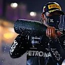 BAHRAIN, BAHRAIN - NOVEMBER 29: Race winner Lewis Hamilton of Great Britain and Mercedes GP celebrates on the podium during the F1 Grand Prix of Bahrain at Bahrain International Circuit on November 29, 2020 in Bahrain, Bahrain. (Photo by Dan Istitene - Formula 1/Formula 1 via Getty Images)