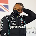 BAHRAIN, BAHRAIN - NOVEMBER 29: Race winner Lewis Hamilton of Great Britain and Mercedes GP celebrates on the podium during the F1 Grand Prix of Bahrain at Bahrain International Circuit on November 29, 2020 in Bahrain, Bahrain. (Photo by Bryn Lennon/Getty Images)