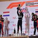 BAHRAIN, BAHRAIN - NOVEMBER 29: Race winner Lewis Hamilton of Great Britain and Mercedes GP, second placed Max Verstappen of Netherlands and Red Bull Racing and third placed Alexander Albon of Thailand and Red Bull Racing celebrate on the podium during the F1 Grand Prix of Bahrain at Bahrain International Circuit on November 29, 2020 in Bahrain, Bahrain. (Photo by Giuseppe Cacace - Pool/Getty Images)