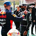 SPA, BELGIUM - AUGUST 29: Pole position qualifier Lewis Hamilton of Great Britain and Mercedes GP and third place qualifier Max Verstappen of Netherlands and Red Bull Racing talk in parc ferme during qualifying for the F1 Grand Prix of Belgium at Circuit de Spa-Francorchamps on August 29, 2020 in Spa, Belgium. (Photo by Francois Lenoir/Pool via Getty Images)