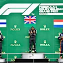 SPA, BELGIUM - AUGUST 30: Race winner Lewis Hamilton of Great Britain and Mercedes GP, second placed Valtteri Bottas of Finland and Mercedes GP and third placed Max Verstappen of Netherlands and Red Bull Racing stand on the podium during the F1 Grand Prix of Belgium at Circuit de Spa-Francorchamps on August 30, 2020 in Spa, Belgium. (Photo by John Thuys/Pool via Getty Images)