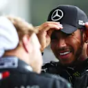 SPA, BELGIUM - AUGUST 30: Race winner Lewis Hamilton of Great Britain and Mercedes GP speaks with teammate and second placed Valtteri Bottas of Finland and Mercedes GP in parc ferme during the F1 Grand Prix of Belgium at Circuit de Spa-Francorchamps on August 30, 2020 in Spa, Belgium. (Photo by Dan Istitene - Formula 1/Formula 1 via Getty Images)