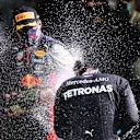SPA, BELGIUM - AUGUST 30: Race winner Lewis Hamilton of Great Britain and Mercedes GP and Third placed Max Verstappen of Netherlands and Red Bull Racing celebrate on the podium during the F1 Grand Prix of Belgium at Circuit de Spa-Francorchamps on August 30, 2020 in Spa, Belgium. (Photo by Lars Baron/Getty Images)