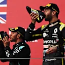 IMOLA, ITALY - NOVEMBER 01: Race winner Lewis Hamilton of Great Britain and Mercedes GP and third placed Daniel Ricciardo of Australia and Renault Sport F1 celebrate on the podium during the F1 Grand Prix of Emilia Romagna at Autodromo Enzo e Dino Ferrari on November 01, 2020 in Imola, Italy. (Photo by Lars Baron - Formula 1/Formula 1 via Getty Images)