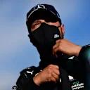 NUERBURG, GERMANY - OCTOBER 10: Pole position qualifier Valtteri Bottas of Finland and Mercedes GP looks on in parc ferme during qualifying ahead of the F1 Eifel Grand Prix at Nuerburgring on October 10, 2020 in Nuerburg, Germany. (Photo by Mario Renzi - Formula 1/Formula 1 via Getty Images)