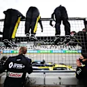NUERBURG, GERMANY - OCTOBER 11: Third placed Daniel Ricciardo of Australia driving the (3) Renault Sport Formula One Team RS20 crosses the line in front of his team celebrating on the pitwall during the F1 Eifel Grand Prix at Nuerburgring on October 11, 2020 in Nuerburg, Germany. (Photo by Peter Fox/Getty Images)