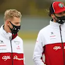 NUERBURG, GERMANY - OCTOBER 08: Mick Schumacher of Germany and Alfa Romeo Racing talks with Antonio Giovinazzi of Italy and Alfa Romeo Racing on a track walk during previews ahead of the F1 Eifel Grand Prix at Nuerburgring on October 08, 2020 in Nuerburg, Germany. (Photo by Bryn Lennon/Getty Images)