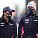 NUERBURG, GERMANY - OCTOBER 08: Sergio Perez of Mexico and Racing Point and Nicholas Latifi of Canada and Williams walk in the Paddock during previews ahead of the F1 Eifel Grand Prix at Nuerburgring on October 08, 2020 in Nuerburg, Germany. (Photo by Mark Thompson/Getty Images)