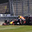 NORTHAMPTON, ENGLAND - JULY 31: Alexander Albon of Thailand driving the (23) Aston Martin Red Bull Racing RB16 crashes into a track barrier during practice for the F1 Grand Prix of Great Britain at Silverstone on July 31, 2020 in Northampton, England. (Photo by Bryn Lennon/Getty Images)