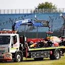 NORTHAMPTON, ENGLAND - JULY 31: The car of Alexander Albon of Thailand and Red Bull Racing is transported back to the pits on a recovery truck after crashing into a track barrier during practice for the F1 Grand Prix of Great Britain at Silverstone on July 31, 2020 in Northampton, England. (Photo by Bryn Lennon/Getty Images)