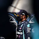 NORTHAMPTON, ENGLAND - AUGUST 01: Pole position qualifier Lewis Hamilton of Great Britain and Mercedes GP talks to the media in parc ferme during qualifying for the F1 Grand Prix of Great Britain at Silverstone on August 01, 2020 in Northampton, England. (Photo by Will Oliver/Pool via Getty Images)